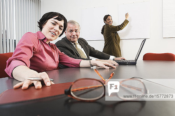 View of business people in a conference room.