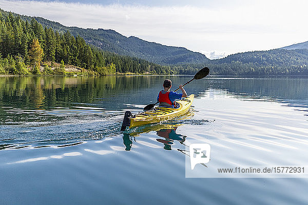 A teenage boy kayaking on White Lake  White Lake Provincial Park; British Columbia  Canada