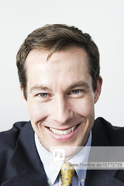 Portrait of a businessman smiling.