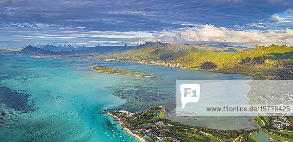 Aerial panoramic of turquoise lagoon surrounding Aux Benitiers and La Gaulette Le Morne Brabant Mauritius Indian Ocean Africa