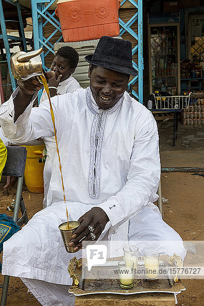 Man preparing tea Agadez Niger West Africa Africa