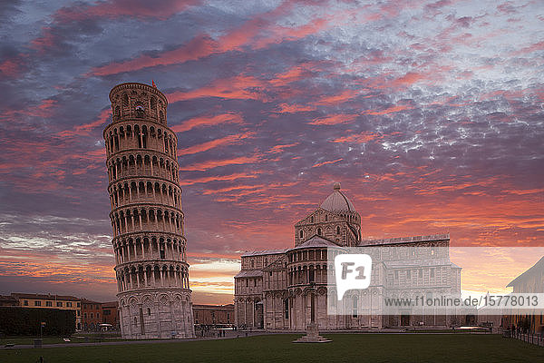 Leaning Tower of Pisa and Piazza dei Miracoli at sunset in Tuscany Italy
