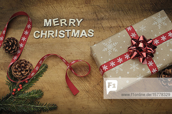 Words 'Merry Christmas' by Christmas present