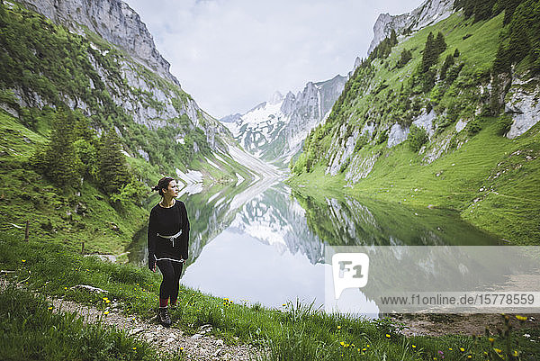 Woman by mountains and lake in Appenzell  Switzerland