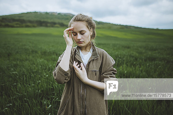 Woman wearing jacket in field in Crimea Ukraine