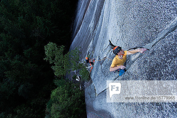 A climber traditional climbing on granite Tantalus Wall Squamish