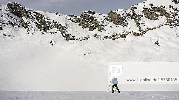 Man on an excursion in snowy mountains  Lombardy  Valtellina  Italy