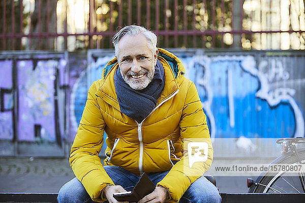 Portrait of smiling mature man in the city