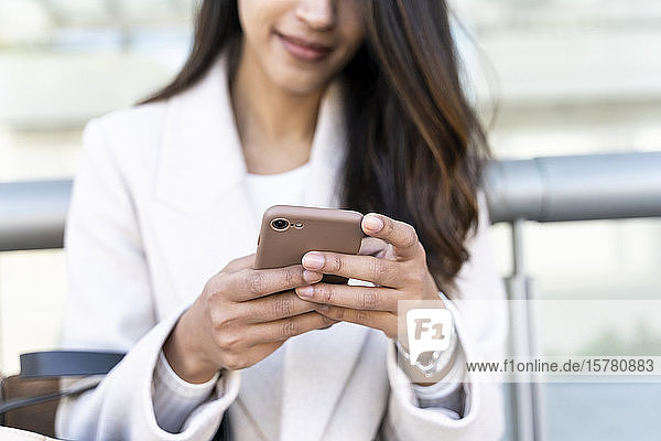 Close-up of woman using smartphone