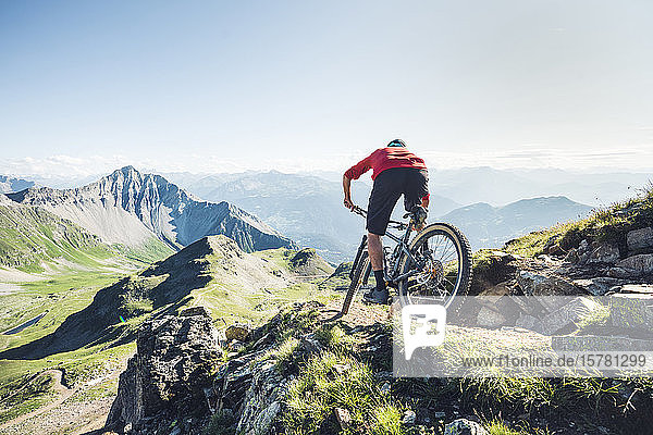Mountainbiker on a way  Grisons  Switzerland