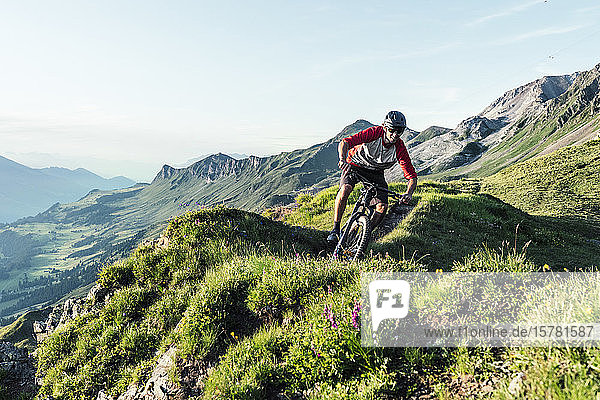 Mountainbiker on a way in Grisons  Switzerland