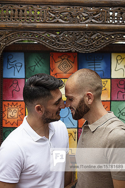 Gay couple rubbing noses