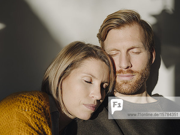 Portrait of relaxed couple in sunlight