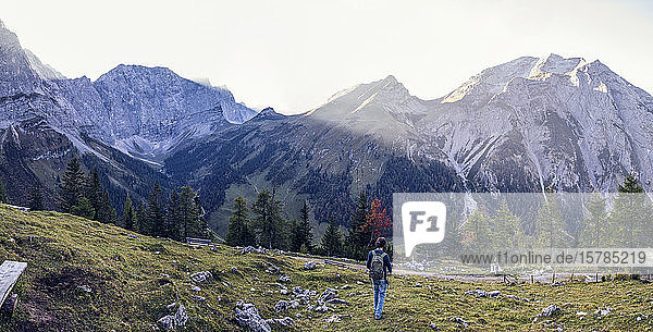 Man hiking the Karwendel mountains in autumn  Hinteriss  Austria