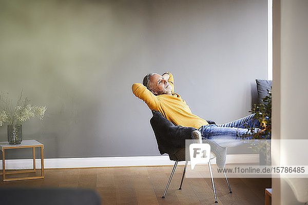 Mature man relaxing at home