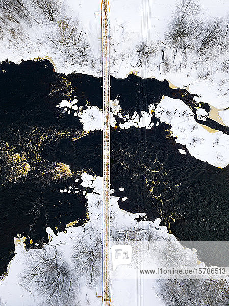 Russia Leningrad Region Tikhvin Aerial view of bridge over Tikhvinka river in Winter