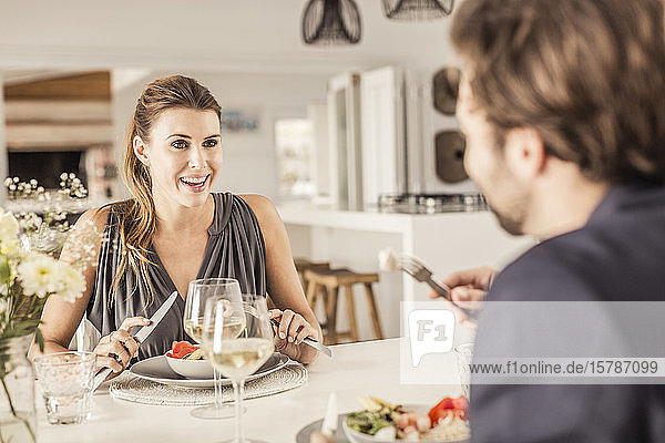Portrait of young woman having dinner with boyfriend