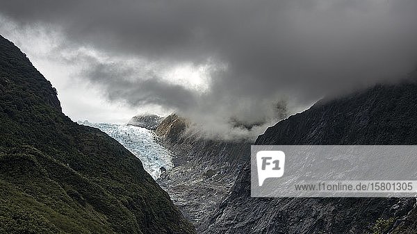 Glacier tongue  Franz Josef Glacier  wrapped in clouds  West coast  South Island  New Zealand  Oceania