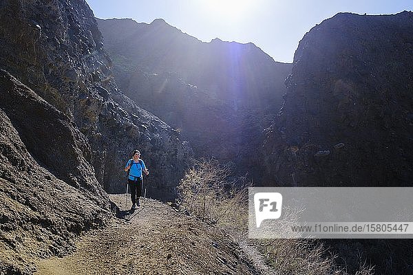 Woman hiking on mountain trail near Taguluche  La Gomera  Canary Islands  Spain  Europe