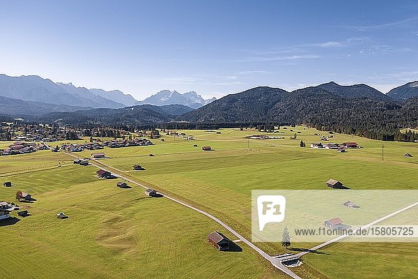 Aerial view fields with barns Bavarian foothills of the Alps Werdenfelser Land Wetterstein range Upper Bavaria Bavaria Germany Europe