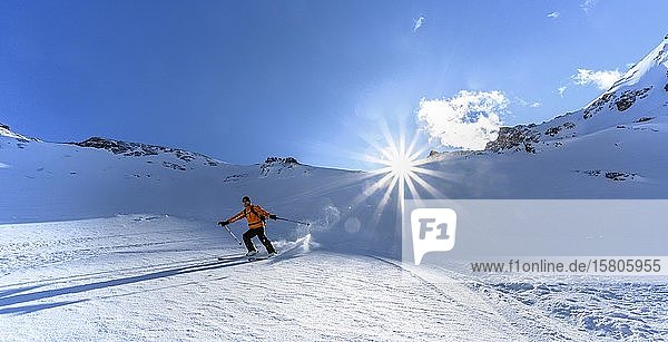 Skier with touring skis skiing in the snow Ski tour Geierspitze Wattentaler Lizum Tuxer Alps Tyrol Austria Europe