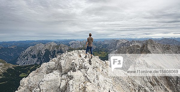Hiker at the summit of the Birkkarspitze  Hinterautal-Vomper chain  Karwendel  Tyrol  Austria  Europe