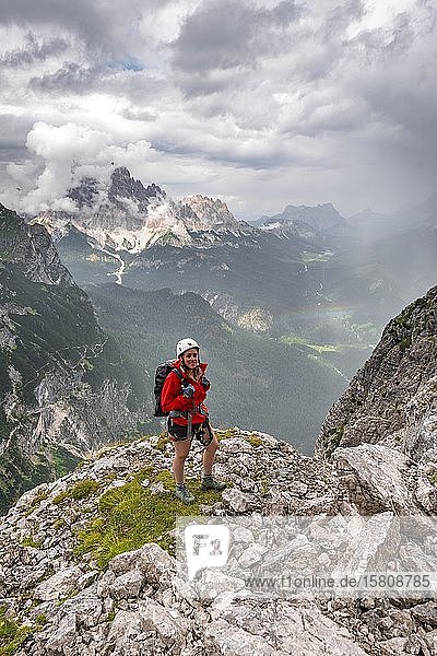 Young woman  hiker in front of Monte Cristallo  Via ferrata Vandelli  Sorapiss circuit  Dolomites  Belluno  Italy  Europe