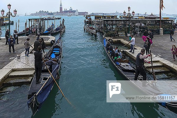 Gondolas with tourists  behind the island of San Giorgio Maggiore  Venice  Veneto  Italy  Europe