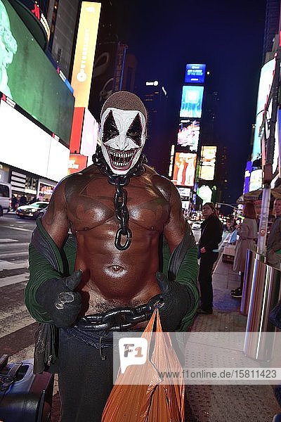 Bodybuilder gets photographed with tourists in Times Square Manhattan New York City New York State USA North America