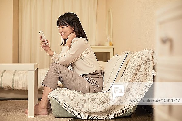 Young Japanese woman in her house