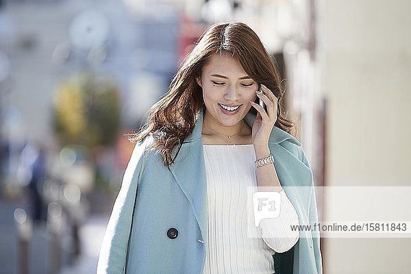 Young Japanese woman downtown Tokyo