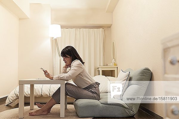 Young Japanese woman in her house