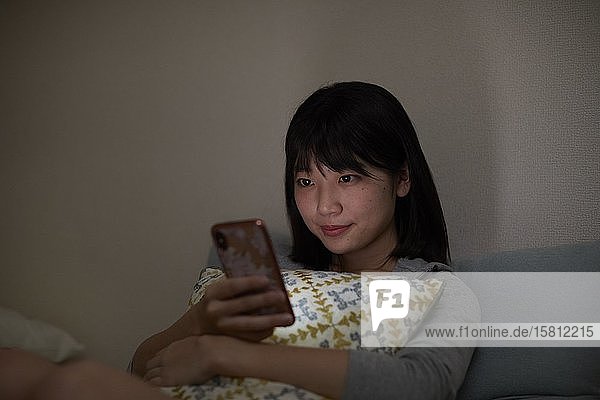 Young Japanese woman in her house