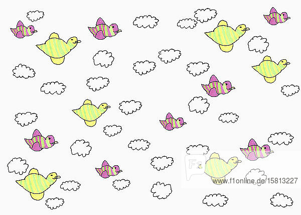 Childs drawing of birds flying among clouds