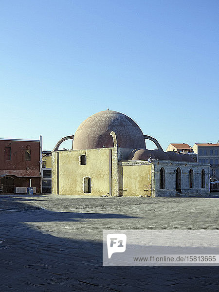 Domed mosque under sunny blue sky Chania Crete Greece