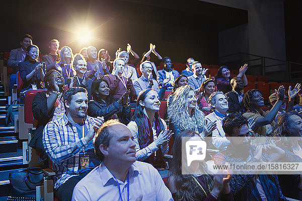 Conference audience clapping
