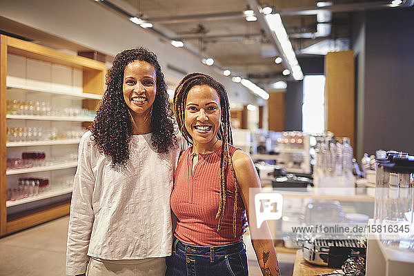 Portrait smiling confident women friends shopping in home goods store