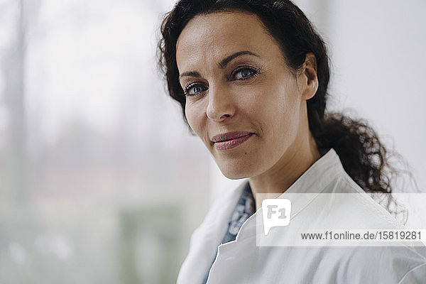 Portrait of confident female doctor  looking at camera