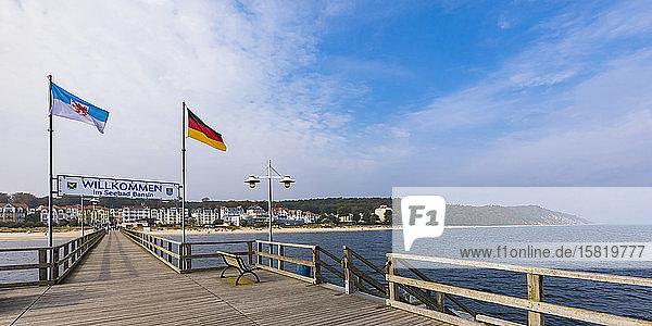 Germany  Mecklenburg-Western Pomerania  Heringsdorf  Welcome sign hanging between national flags over wooden pier