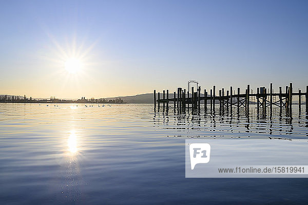 Germany  Baden-Wurttemberg  Constance district  Allensbach  Jetty on Lake Constance at sunset