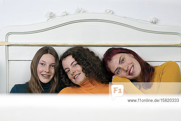 Portrait of three happy sisters