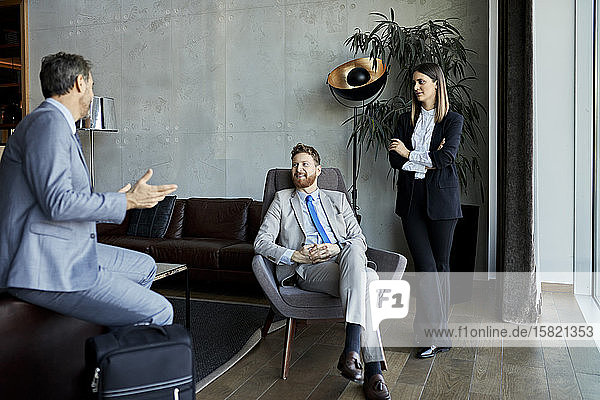 Business people having a meeting in hotel lobby