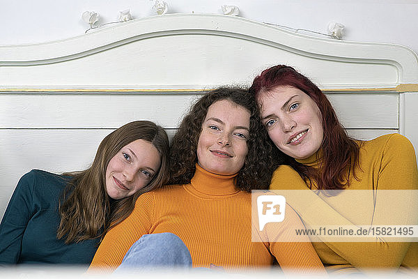 Portrait of three happy sisters