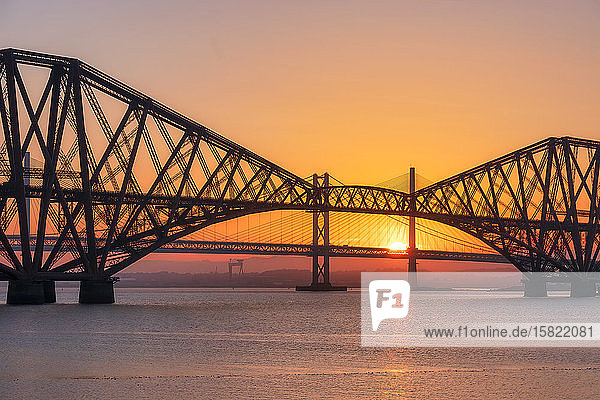 UK  Scotland  Silhouettes of Forth Bridge and Forth Road Bridge at sunset