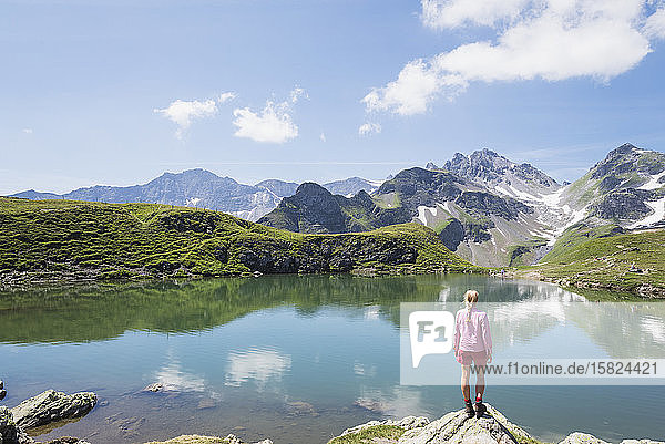 Switzerland  St Gallen Canton  Glarus Alps  Woman looking at Wangs Lake