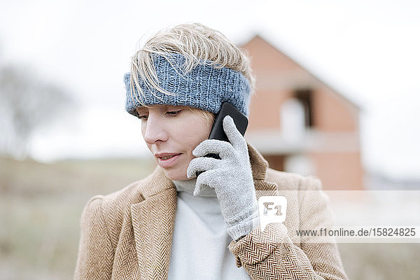 Portrait of mature woman on the phone outdoors