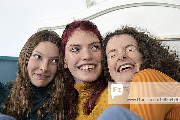 Portrait of three happy sisters