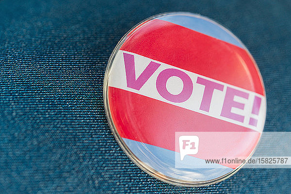 Close up of Vote button on jeans fabric