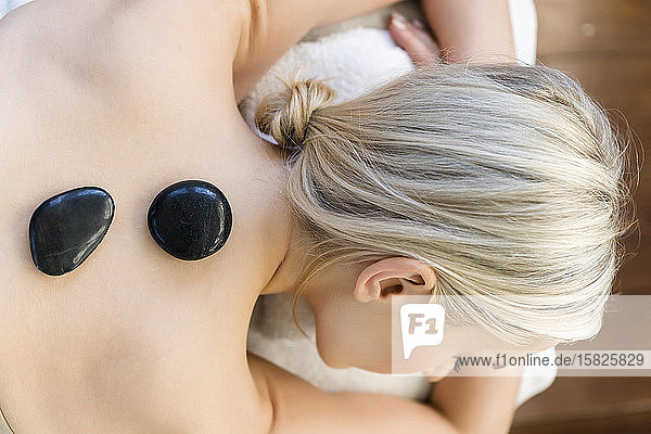 Woman enjoying hot stone massage