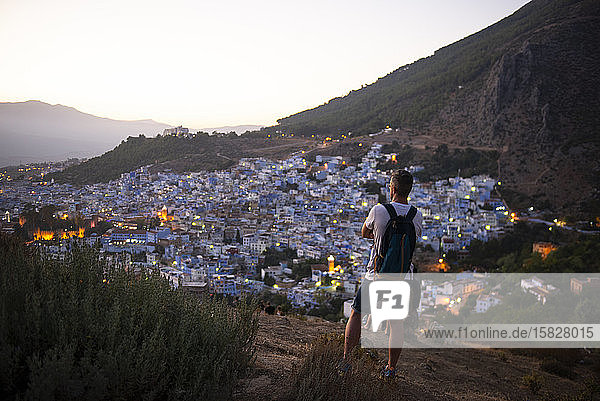 Man photographing the town of Chaouen